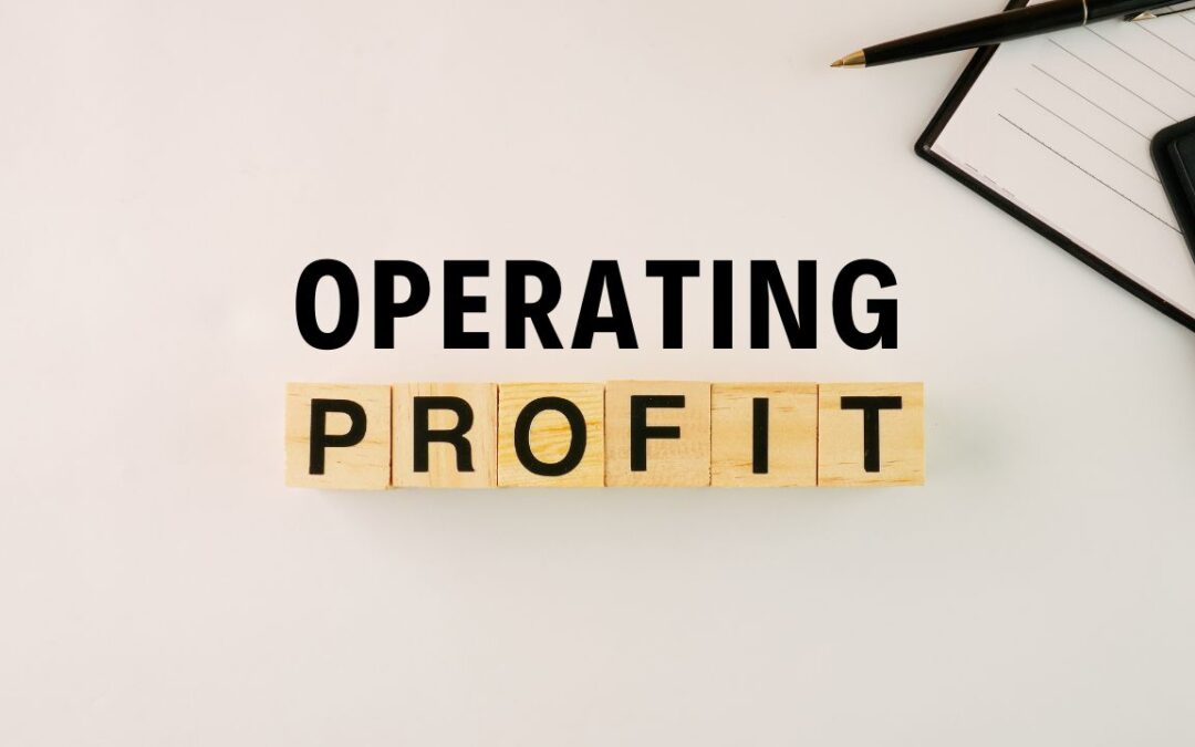 A desk surface on which there are blocks that have the word profit on them. On top of them the word operating is written to read together: operating profit.