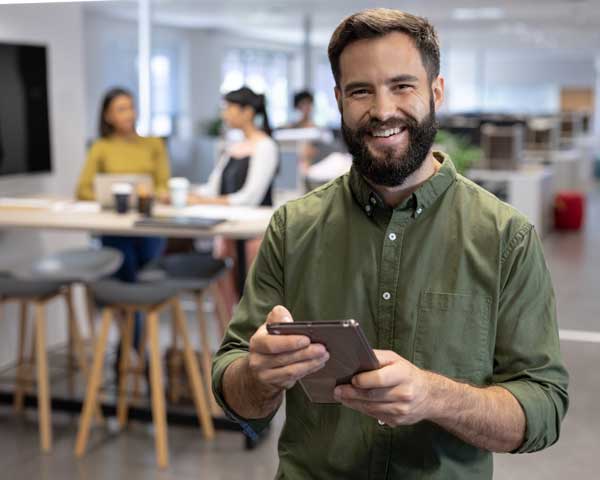Man with tablet calculating profit