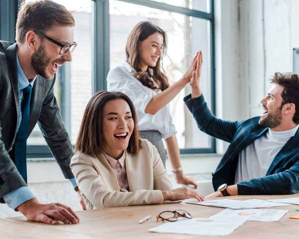 Business team meeting celebrating profit