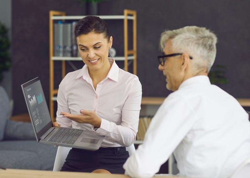 Business people analysing report on captial gains tax